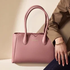 Isabel Bernard Honoré Cloe Midi roze leren handtas van kalfsleer Online